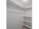 Walk-in closet with shelving and hanging rods for storage and organization at 401 Haywood St, Raleigh, NC 27601