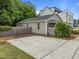 Charming home exterior showcasing a well-manicured lawn, inviting porch, and convenient driveway access at 401 Haywood St, Raleigh, NC 27601
