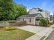 Charming home exterior showcasing a well-manicured lawn, inviting porch, and convenient driveway access at 401 Haywood St, Raleigh, NC 27601