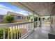 Covered front porch features white railing and posts and neighborhood views at 401 Haywood St, Raleigh, NC 27601