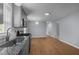 Open kitchen with gray cabinets, stainless steel appliances, and modern countertops at 401 Haywood St, Raleigh, NC 27601