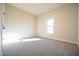 Bright bedroom featuring natural light, carpet, and neutral paint at 404 S Eastwood Dr, Benson, NC 27504