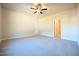 Large carpeted bedroom is highlighted by a ceiling fan at 404 S Eastwood Dr, Benson, NC 27504