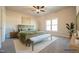 Spacious bedroom showcasing stylish furniture, neutral walls, soft carpet and a ceiling fan at 404 S Eastwood Dr, Benson, NC 27504