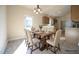 Charming dining area with a wooden table set for six, and easy access to the patio at 404 S Eastwood Dr, Benson, NC 27504
