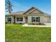 Charming single-story home with green siding and a well-manicured lawn at 404 S Eastwood Dr, Benson, NC 27504