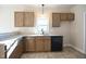 Kitchen features granite countertops, stainless steel sink, and modern appliances at 404 S Eastwood Dr, Benson, NC 27504