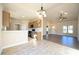 Open concept kitchen view shows island, eating area, and view to living room at 404 S Eastwood Dr, Benson, NC 27504