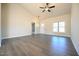 Open living room with wood flooring, high ceilings, and ample natural light at 404 S Eastwood Dr, Benson, NC 27504