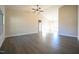 Large living room with wood flooring, high ceilings, and neutral paint at 404 S Eastwood Dr, Benson, NC 27504