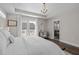 Spacious bedroom featuring a queen-sized bed, a balcony, and an ensuite bathroom at 43 Quarter Gate Trce, Chapel Hill, NC 27516