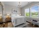 Bright bedroom featuring a queen-sized bed, a Persian rug, and a bedside table at 43 Quarter Gate Trce, Chapel Hill, NC 27516