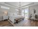 Bright bedroom featuring a queen-sized bed, a balcony, and a vanity table at 43 Quarter Gate Trce, Chapel Hill, NC 27516