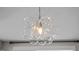 Close-up of a contemporary light fixture with multiple glass globes, enhancing the room's decor at 43 Quarter Gate Trce, Chapel Hill, NC 27516