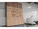 Close up of a wooden cutting board with location coordinates, and a mortar and pestle at 43 Quarter Gate Trce, Chapel Hill, NC 27516