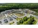 Aerial view of a well-maintained school with ample parking and green spaces, perfect for families at 43 Quarter Gate Trce, Chapel Hill, NC 27516