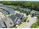 Beautiful street view of modern homes with manicured lawns in a serene neighborhood near a lake at 43 Quarter Gate Trce, Chapel Hill, NC 27516
