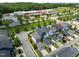 Desirable neighborhood showcasing modern homes with well-kept lawns and a school nearby at 43 Quarter Gate Trce, Chapel Hill, NC 27516