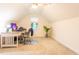Well-lit carpeted room with desk, chair, and potted plant offering comfortable work and study space at 474 Pine Ridge Rd, Zebulon, NC 27597