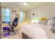 Bedroom with desk and chair and a white ceiling fan at 474 Pine Ridge Rd, Zebulon, NC 27597