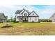 Charming two-story home with a well-manicured lawn and welcoming front porch at 474 Pine Ridge Rd, Zebulon, NC 27597