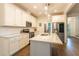 A bright kitchen with stainless steel appliances, an island, and white subway tile backsplash at 474 Pine Ridge Rd, Zebulon, NC 27597