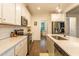 This kitchen has stainless steel appliances and white cabinets, countertops, and backsplash at 474 Pine Ridge Rd, Zebulon, NC 27597