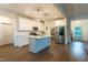 This kitchen has stainless steel appliances, white cabinets, and an island with bar seating at 474 Pine Ridge Rd, Zebulon, NC 27597