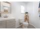 Clean, simple bathroom with modern fixtures, stylish mirror, and a neutral color palette at 504 High Ridge Dr, Durham, NC 27707