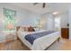Comfortable bedroom featuring a large bed, windows, and hardwood floors, perfect for relaxation at 504 High Ridge Dr, Durham, NC 27707