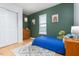 Bright bedroom featuring hardwood floors, a closet and window at 504 High Ridge Dr, Durham, NC 27707