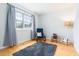 Bright bedroom with a large window, hardwood flooring and cozy furniture at 504 High Ridge Dr, Durham, NC 27707