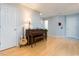 Welcoming foyer with natural light, hardwood floors, an acoustic guitar and vintage piano at 504 High Ridge Dr, Durham, NC 27707