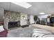 Spacious basement with stone fireplace, exercise area, and media center at 506 Burgess Rd, Apex, NC 27523