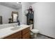 Bathroom with vanity and sink next to the toilet and cabinet at 506 Burgess Rd, Apex, NC 27523