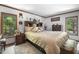 Bedroom suite with wood trim, ample natural light, and comfortable furnishings at 506 Burgess Rd, Apex, NC 27523