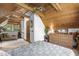 Bedroom boasting a beamed wood ceiling with an adjacent lounge and ensuite bathroom at 506 Burgess Rd, Apex, NC 27523