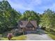 Front elevation of the home showing the deck and front yard at 506 Burgess Rd, Apex, NC 27523