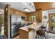 This kitchen is equipped with stainless appliances, a breakfast bar and wood accents at 506 Burgess Rd, Apex, NC 27523