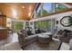 Open living room with vaulted wood ceiling, large windows and sliding doors to the outdoor deck at 506 Burgess Rd, Apex, NC 27523