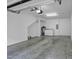 Spacious garage with large white walls, concrete floor, and washer and dryer in the corner at 506 N Mangum St # 402, Durham, NC 27701