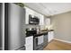 Modern kitchen featuring stainless steel appliances, sleek countertops, and ample cabinet space at 506 N Mangum St # 402, Durham, NC 27701