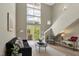 Inviting living room with high ceilings, abundant natural light, and stylish decor at 506 N Mangum St # 402, Durham, NC 27701