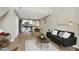 Open concept living space with modern furniture, sleek hardwood floors, and a dining area at 506 N Mangum St # 402, Durham, NC 27701