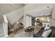 Open-concept living space with stairs to a second floor, seamlessly connecting living, dining, and kitchen areas at 506 N Mangum St # 402, Durham, NC 27701