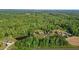 Beautiful home with a large backyard, pond, and lush landscaping; the perfect retreat for relaxation and outdoor activities at 5250 Sartin Rd, Burlington, NC 27217