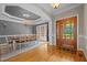 Elegant dining room with wood floors, chandelier, and a stylish table set for dinner at 5250 Sartin Rd, Burlington, NC 27217