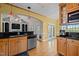 A kitchen that offers stainless steel appliances, wooden floors, and double doors opening to the deck at 5250 Sartin Rd, Burlington, NC 27217