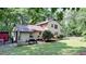 Large backyard with a deck, grill and ample space for outdoor activities and entertaining at 5728 Carriagehouse Ct, Apex, NC 27539