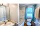 Cozy bathroom featuring a vanity sink, bathtub, and neutral paint at 5728 Carriagehouse Ct, Apex, NC 27539